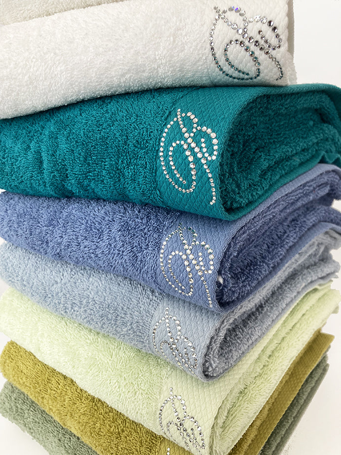 Set asciugamani spugna 1+1 con logo in swarovski Benessere